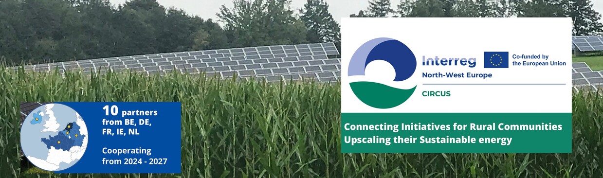 The picture shows a green field with electric panels in the background.